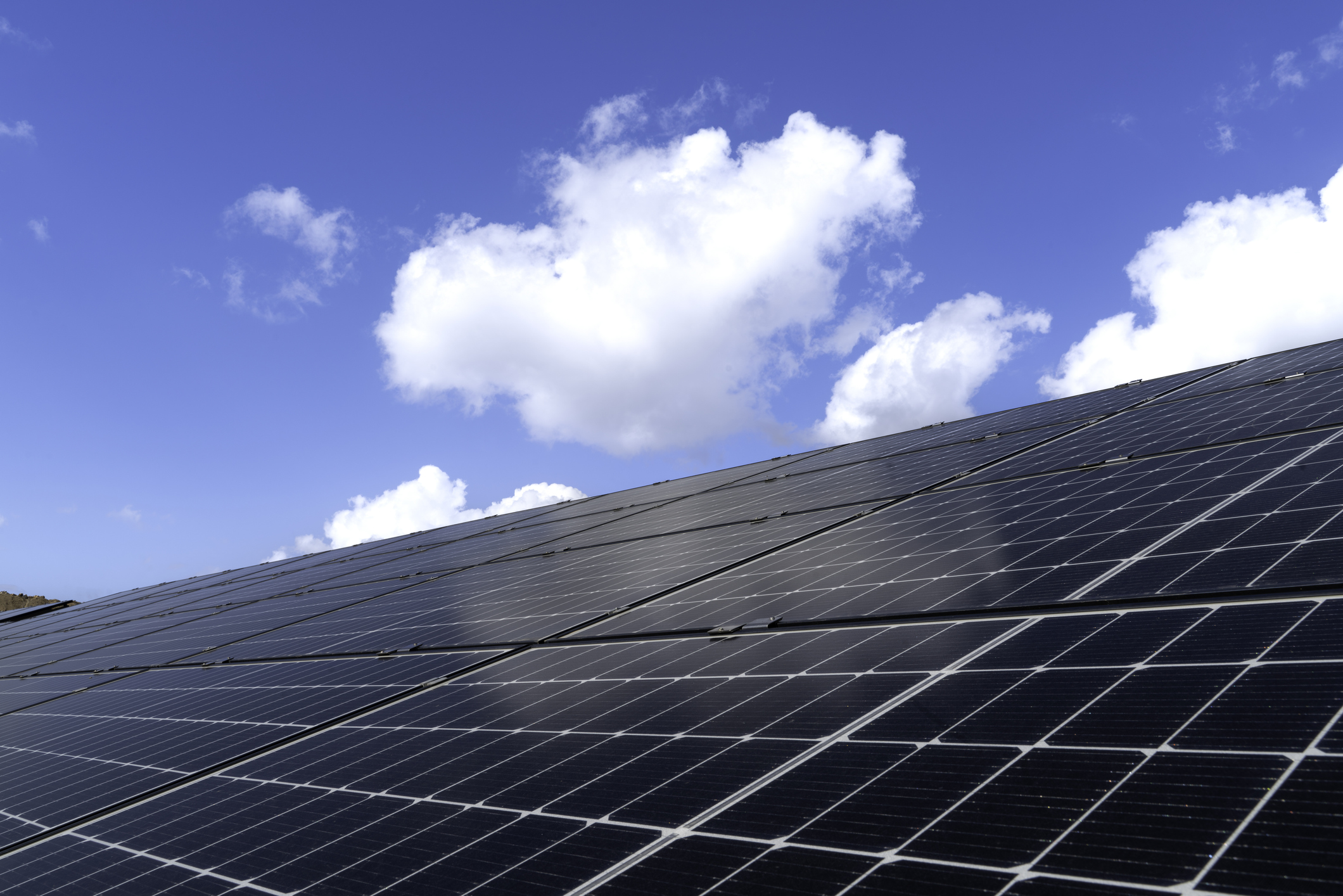 Solar Panel On Blue Sky Background, Alternative Energy Concept, Solar Power Station For Producing Electric Power Energy By Green Power.